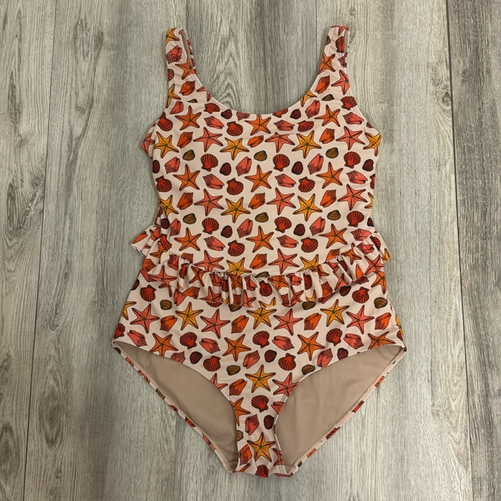 Kortni Jeane large skirted seashell one piece bathing suit